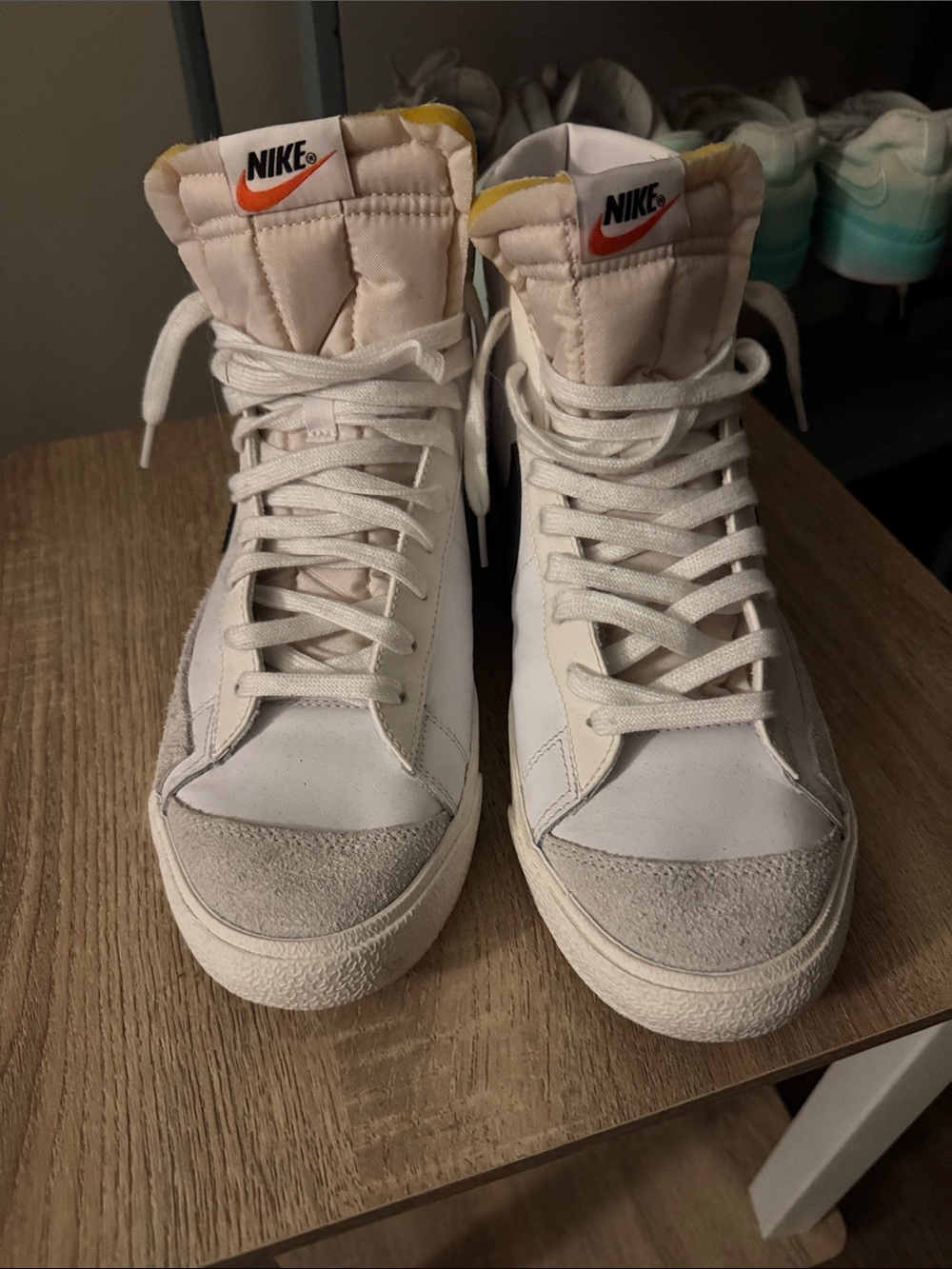 Nike White High-Top Sneakers with Orange Swoosh